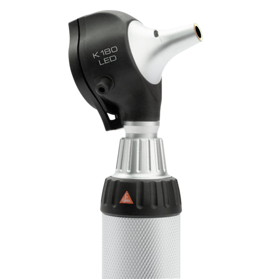 A K180 LED otoscope with a black and silver head, a textured silver handle, and a small orange warning triangle, shown on a solid white background.