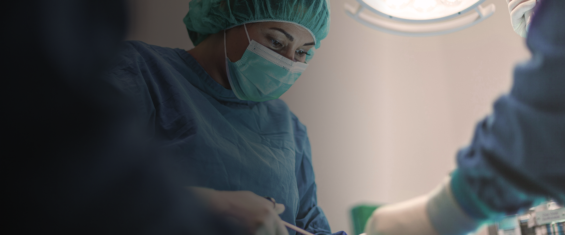 Medical professionals in an operating room setting.
