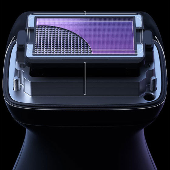 Close-up of a black ultrasound device with a grid pattern on a dark background