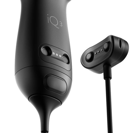 a close-up photo of a black portable ultrasound device and its charger on a white background